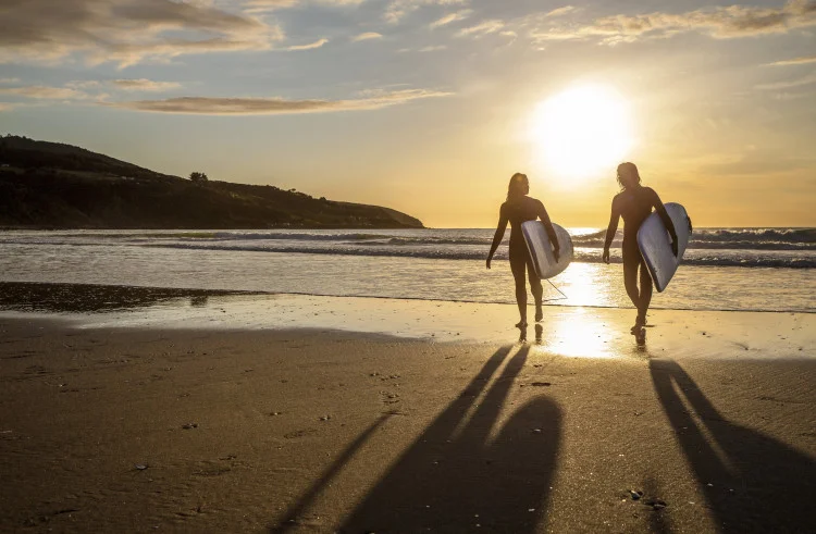 Surfing in Raglan - Credit: Camilla Rutherford