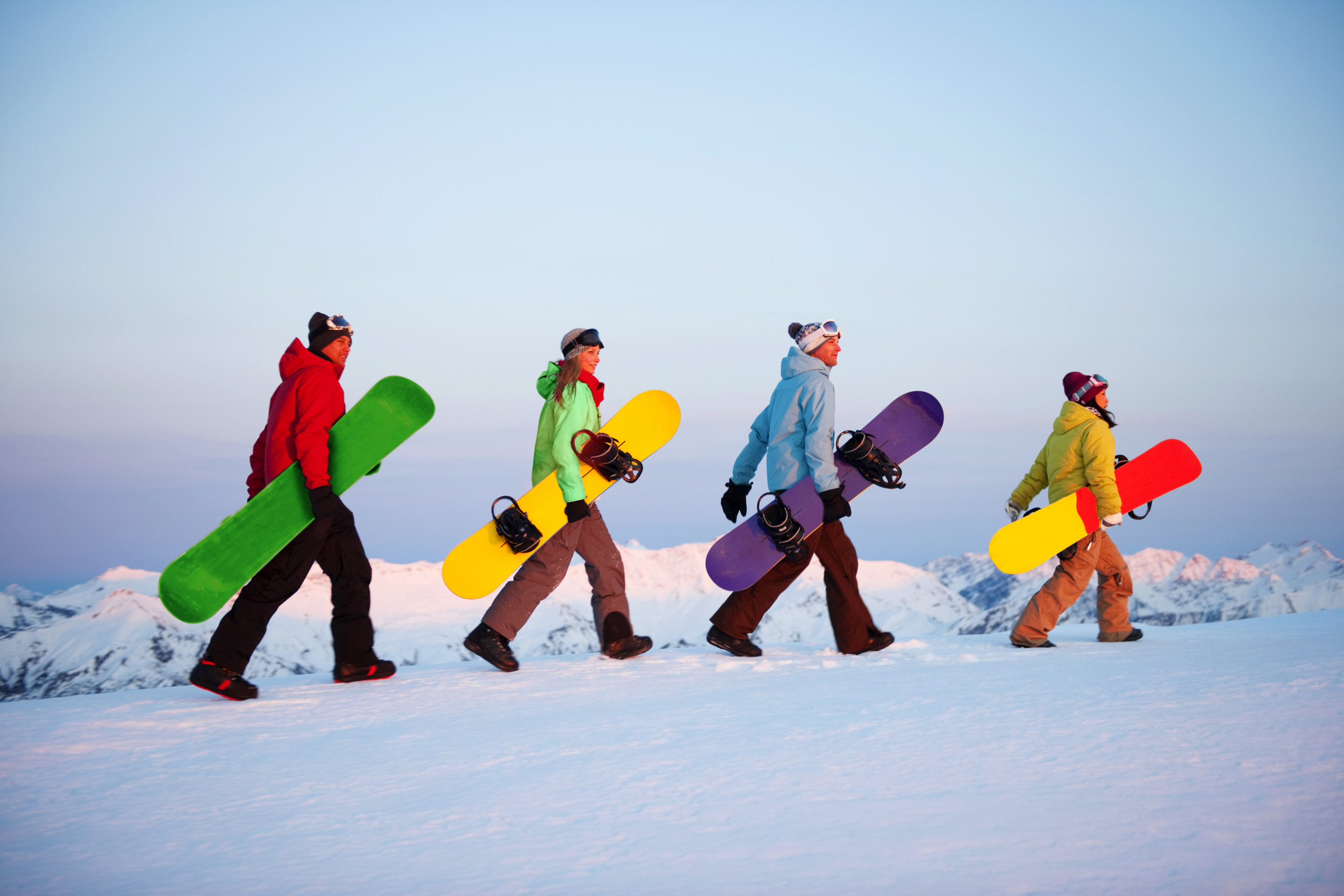 snow boarders in a line