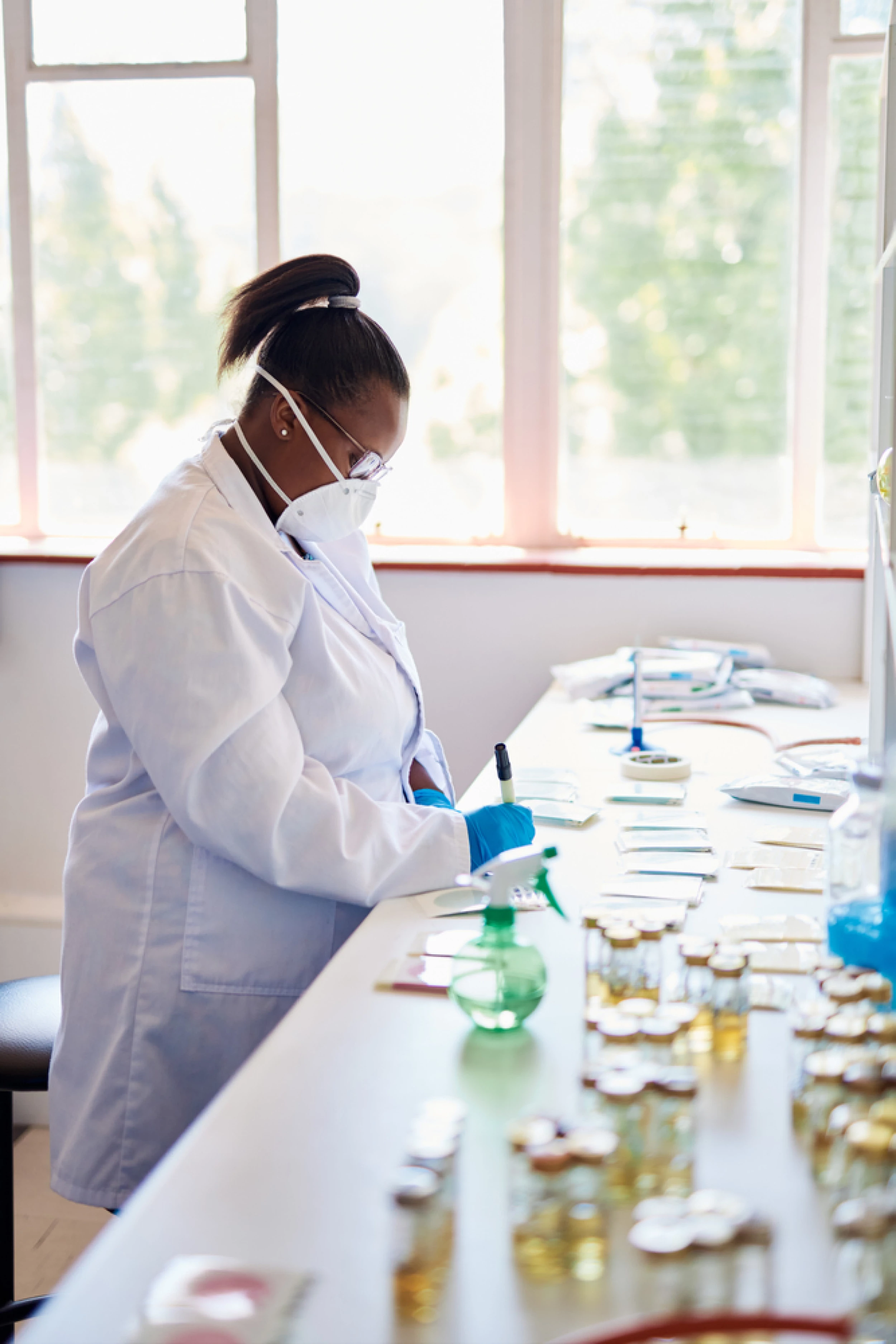 Pathologist at table (stock image)