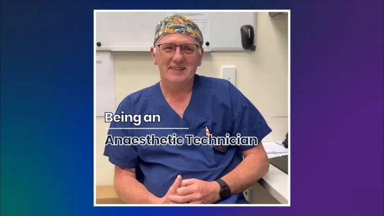 A senior Anaesthetic Technician in blue scrubs sitting down in the patients' ward. In the foreground it says "Being an Anaesthetic Technician".